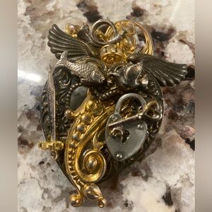 Ornate mixed-metal assemblage brooch